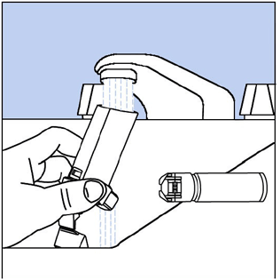 Hold the actuator under the faucet and run warm water through - Illustration